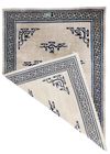 A LARGE ANTIQUE CHINESE PEKING RUG WITH IMPERIAL DRAGON DESIGN