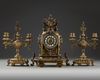 A NEO-RENAISSANCE STYLE BRONZE CLOCK AND CANDLELABRA SET, LATE 19TH CENTURY