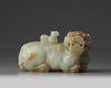 A CHINESE CELADON AND RUSSET JADE BUDDHIST LION WATER DROPPER, CHINA, QING DYNASTY (1644-1911)
