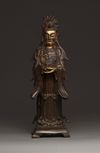 A Chinese parcel-gilt bronze figure of Xiwangmu