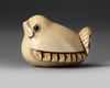 A JAPANESE IVORY NETSUKE OF THE SHAPE OF A SPARROW, SECOND HALF 19TH CENTURY