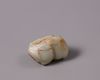 A Chinese celadon and russet jade carving of two peaches