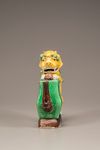 A moulded yellow, green, and aubergine-glazed teapot
