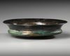AN ACHAEMENID BRONZE LOTUS PHIALE, CIRCA 6TH-5TH CENTURY B.C.