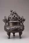 A Chinese bronze tripod censer and cover