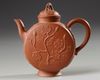 A Chinese yixing 'peony and chilong' flattened teapot and cover