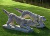 A PAIR OF COMPOSITION STONE HUNTING DOGS, 20TH CENTURY