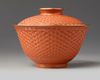 A Chinese imitation-cinnabar lacquer bowl and cover