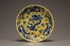 A yellow-ground blue and white 'dragon' dish
