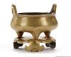 A GILT CHINESE TRIPOD BRONZE CENSER AND A STAND, 18TH-19TH CENTURY