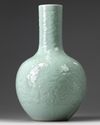 A CHINESE CARVED AND MOULDED CELADON-GLAZED BOTTLE VASE