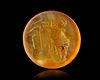 A ROMAN CARNELIAN INTAGLIO OF A SATYR, 1ST CENTURY AD