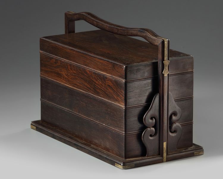 A CHINESE HONGMU THREE-TIERED PICNIC BOX, TIHE 