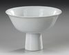 A CHINESE WHITE-GLAZED ANHUA DRAGON STEM CUP, EARLY 18TH CENTURY
