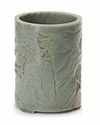 A CHINESE CARVED SPINACH-GREEN JADE BRUSH POT, 19TH CENTURY