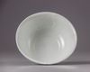 A Chinese Shufu-style white-glazed moulded 'dragon' bowl