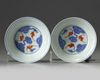 A pair of Chinese iron-red and gilt decorated blue and white bowls and cover