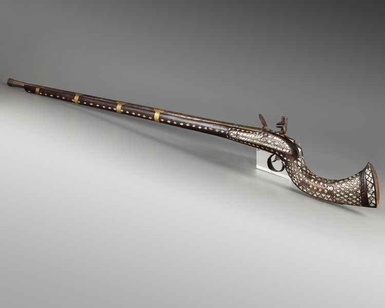 An Islamic Ottoman mother-of-pearl inlaid Miquelet gun