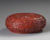 A CHINESE RED-LACQUERED 'PEONIES' BOX AND COVER, 19TH-20TH CENTURY