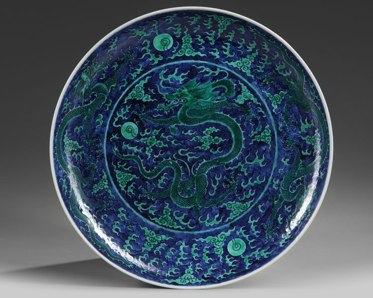 A Chinese blue ground green-enamelled 'dragon' charger