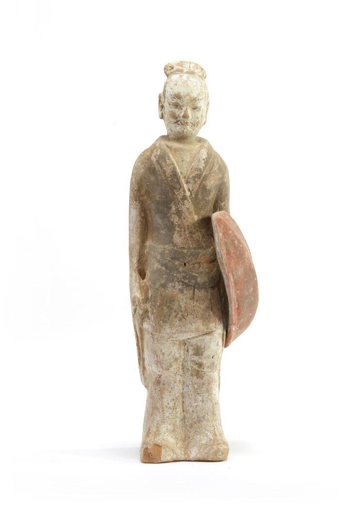 A Chinese painted pottery model of a standing warrior