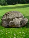A SUBSTANTIAL LIMESTONE MODEL OF A GIANT TORTOISE, LATE 20TH CENTURY