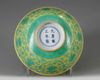 A Chinese yellow-ground green-enamelled 'Eight Buddhist Emblems' bowl