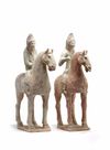 A pair of Chinese pottery equestrians
