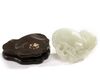 A Chinese pale celadon jade 'twin catfish' carving