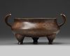 A Chinese bronze tripod censer