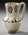 A FINE SLIP-PAINTED POTTERY MUG, PERSIA, 9TH-10TH CENTURY