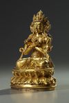 A Sino-Tibetan gilt bronze figure of Vajradhara