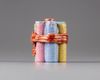 A famille rose 'candles tied by a ribbon' pot and cover