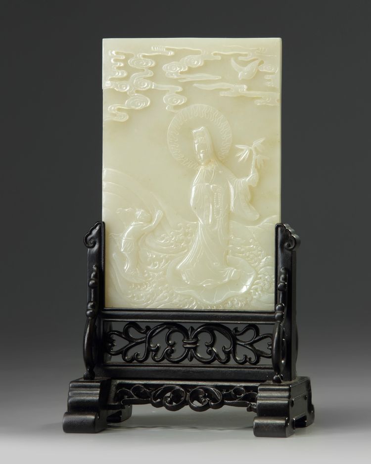 A CHINESE CELADON JADE 'GUANYIN' TABLE SCREEN, QING DYNASTY (1644-1911)