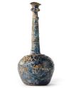 A TALL-NECKED BLUE GLASS BOTTLE, PERSIA OR SYRIA, 11TH-12TH CENTURY