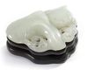 A Chinese pale celadon jade 'twin catfish' carving