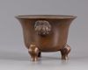 A Chinese bronze tripod censer