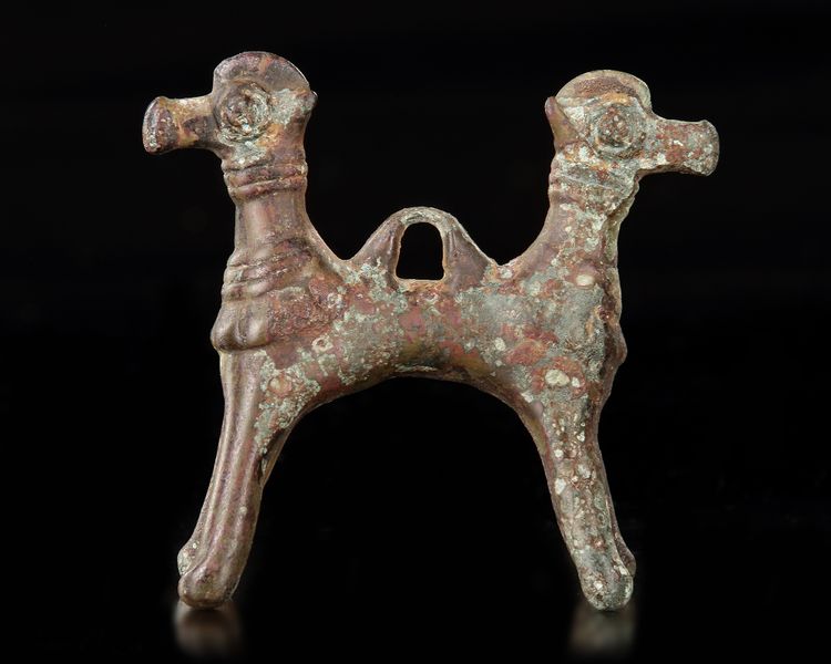 A BRONZE DOUBLE HEADED MYTHOLOGICAL ANIMAL, LURISTAN PERIOD, 1ST MILLENNIUM BC