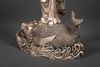 A METAL SCULPTURE OF GUANYIN STANDING ON A FISH, 20TH CENTURY