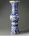 A large Chinese Ming-style blue and white 'mythical beasts' gu vase