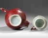 A CHINESE RUBY-RED GLAZED MONK'S CAP EWER