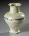 A RAQQA BLUE AND WHITE POTTERY JAR, SYRIA, 13TH CENTURY