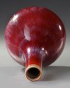 A CHINESE FLAMBÉ-GLAZED BOTTLE VASE, QING DYNASTY (1644-1911)