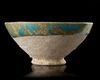 A KASHAN TURQUOISE GLAZED BOWL, PERSIA, 12TH CENTURY
