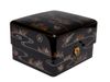 A large black Japanese lacquered box with a curved lid