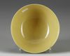 A Chinese yellow-ground green-enamelled 'Eight Buddhist Emblems' bowl