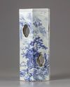 A blue and white hat stand