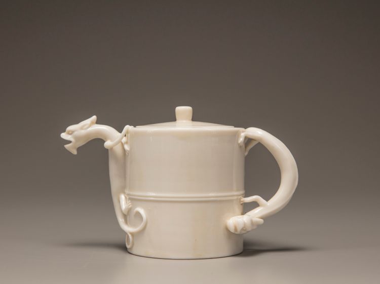 A white-glazed wine pot and cover