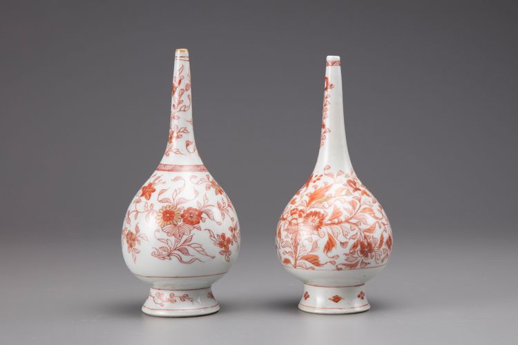 A pair of iron-red globular rosewater sprinklers