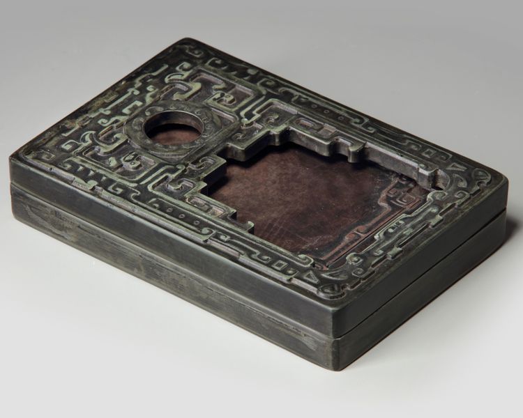 A Chinese inkstone and box